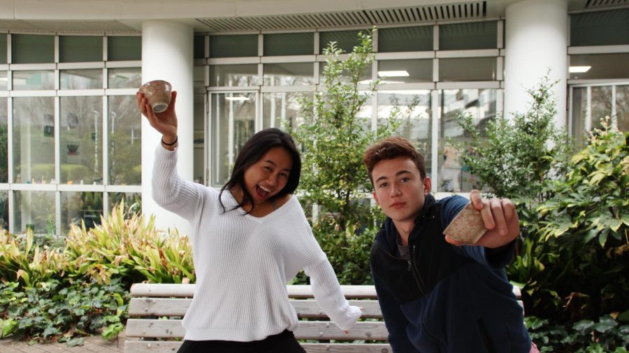 Seniors Ann-Li Hitosugi and Masa Kawasaki pose with traditional Japanese tea cups to advertise their "Spillin' the Tea" column. Their first sip of "tea” available on the site.