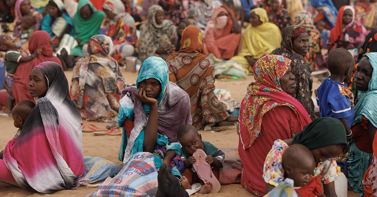 ADRE, CHAD - APRIL 22: Refugees, mostly women and children, wait for a WFP food distribution point to open at a temporary camp on April 22, 2024 in Adre, Chad. Since the beginning of the recent conflict between the paramilitary Rapid Support Forces (RSF) and the the Sudanese Armed Forces, (SAF), which began in March 2023, over 600,000 new refugees have crossed the border from Darfur in Sudan, into Chad. The total number of refugees, including those from previous conflicts, now stands at 1.2 million. Aid agencies, including The World Food Programme, (WFP), Médecins Sans Frontières (MSF) and the United Nations High Commissioner for Refugees, (UNHCR), already struggling with accute supply shortages, have warned that the life-saving programmes in Chad, will ‘grind to a halt in a matter of weeks without urgent funding’. Chad is now home to one of the largest and fastest-growing refugee populations in Africa. (Photo by Dan Kitwood/Getty Images)